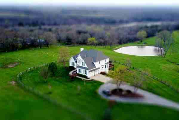 Aerial View of Country Home with Pond